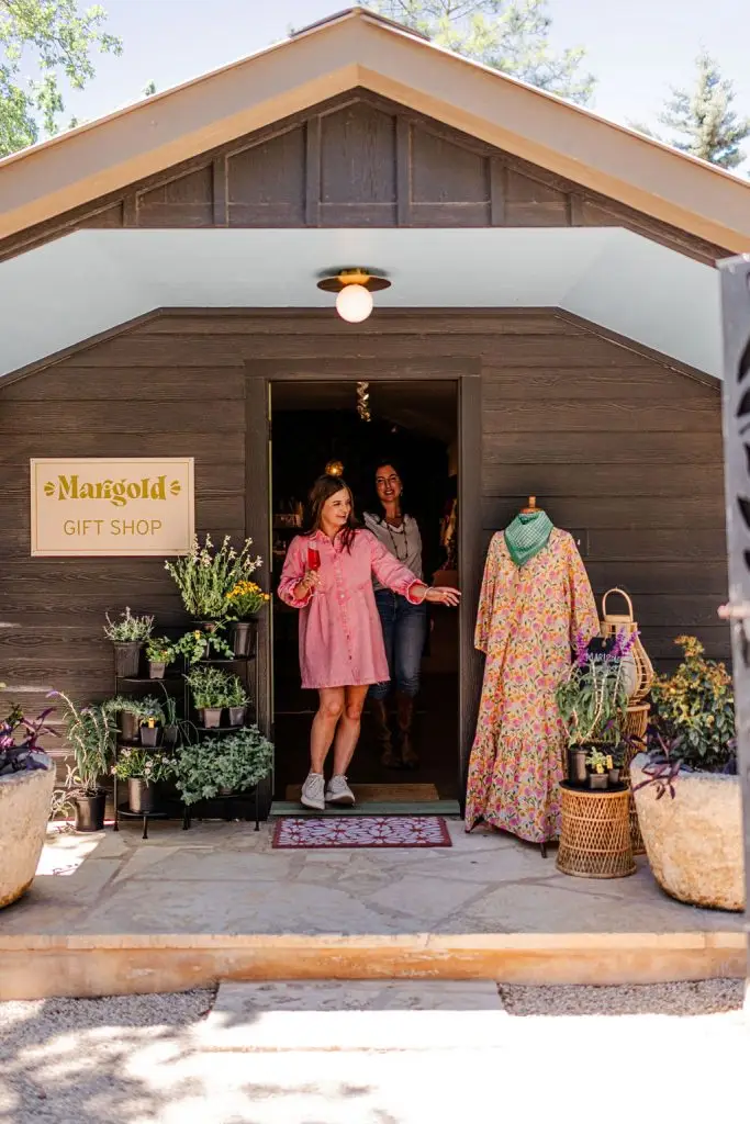 Ladies shopping with a mimosa in hand at the Marigold Gift Shop in Fredericksburg, Texas