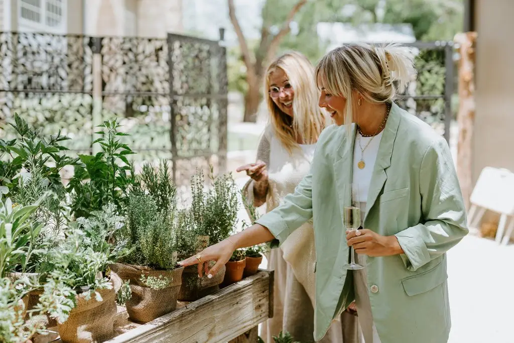 Two guests explore the gardens before dining at Hill Country Herb Garden Restaurant.