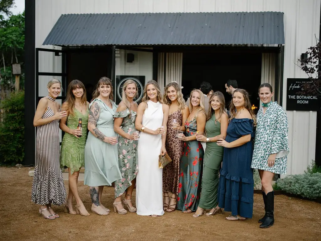 A bride poses with her friends at Hill Country Herb Garden Restaurant.